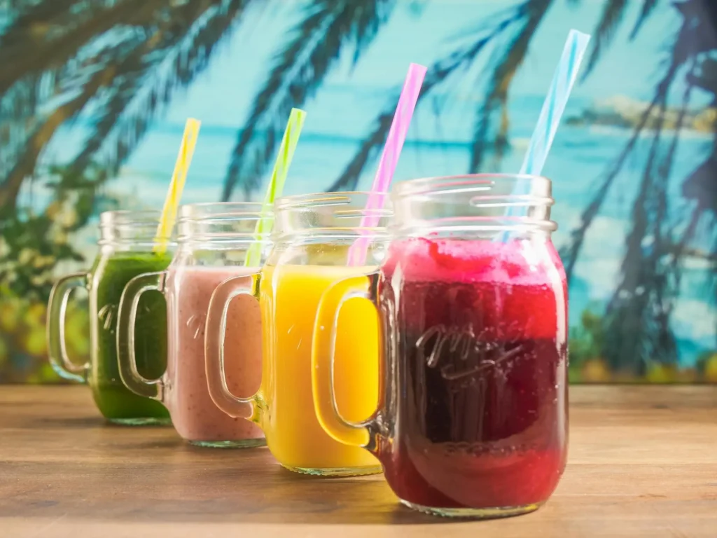 Refreshing organic drinks, including lemon mint cooler and berry hibiscus iced tea, perfect for hydration and a healthy lifestyle