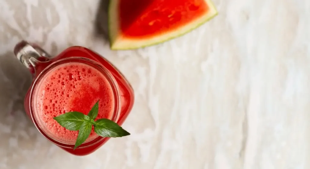 Glass of organic watermelon and basil juice.