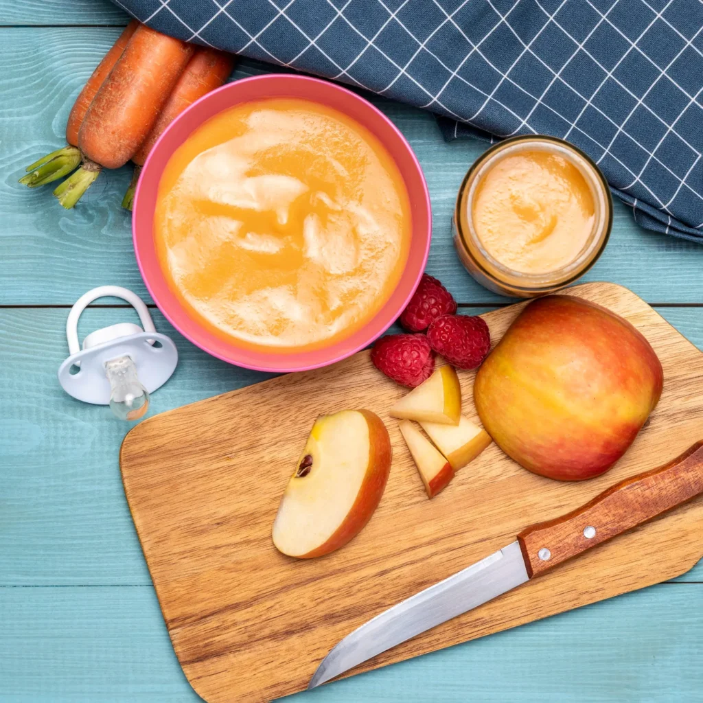 Homemade baby food recipe with carrot and apple puree for 6 to 9 month old babies