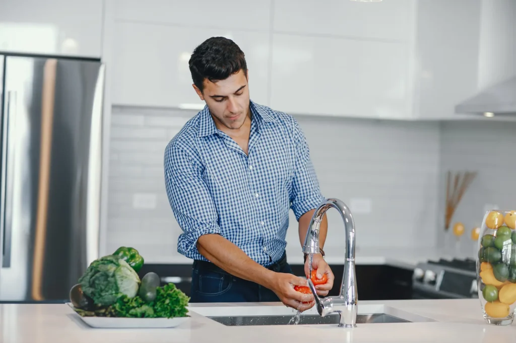 Washing apples & vegetables in a water to reduce pesticide residue