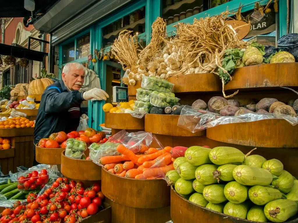 Grocery cart with conventional and organic produce side by side